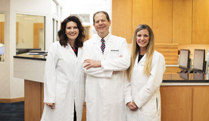 Dr. Schlessinger, MD and staff members at Schlessinger MD.